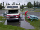 Michael unhooking us in the driving rain at our camp at L'islet sur Mer