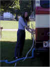 Janee unhooking the water