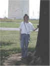 Janee relaxing in the shade, the Washington Monument in the background