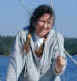 Janee laughing while she watches for whales