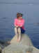 Janee looking out at a sailboat at Stonington, CT