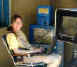Janee talks with some friends on ICQ while she waits for the upload to finish. (Dayton KOA)