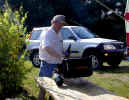 Michael cooking burgers on the grill