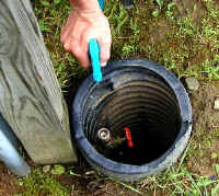 Michael sprays chlorine on the fresh-water outlet before hooking up our hose.