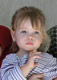 Mira watching the baby-naming ceremony with interest